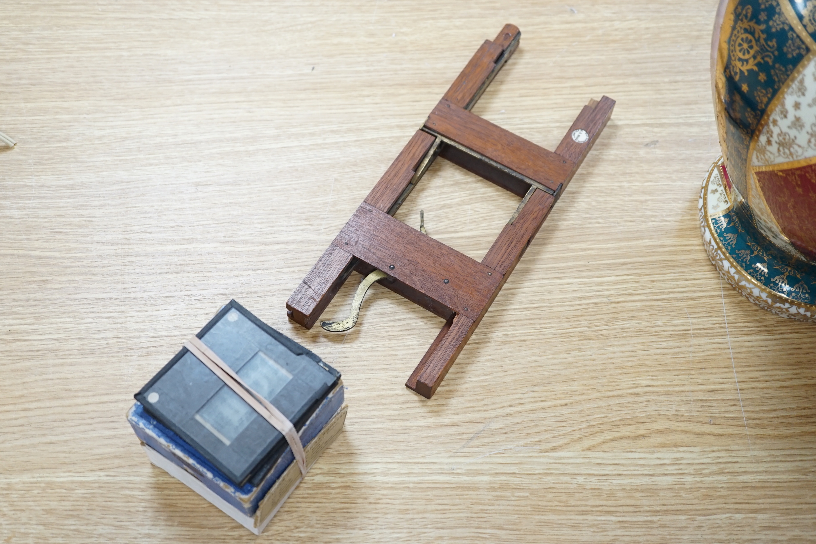 A late Victorian brass mounted mahogany magic lantern by Dunscombe, Bristol with a small quantity of slides (converted to electricity)